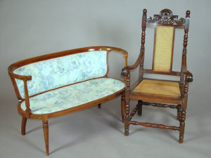 An Edwardian mahogany and inlaid two seat parlour settee the