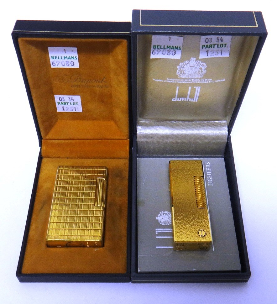 A gilt metal rectangular cased Dunhill gas lighter with the