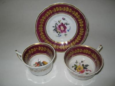 AN ENGLISH PORCELAIN TRIO 19th century painted to the interior