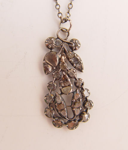 ROSE CUT DIAMONDS IN STERLING NECKLACE Sterling silver pendant contains