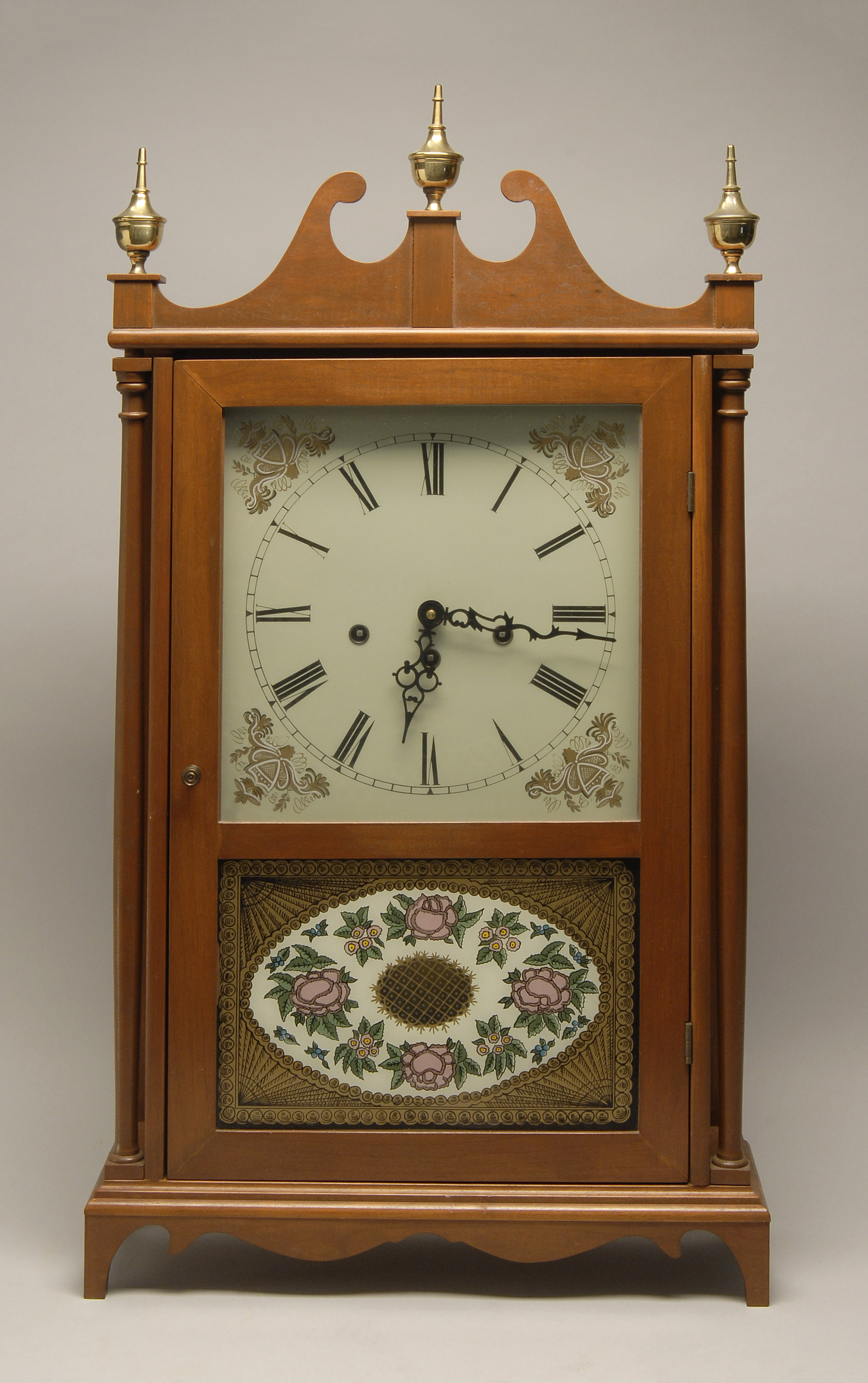 PILLAR SCROLL STYLE CLOCK 20th CenturyIn mahogany case Retailed through