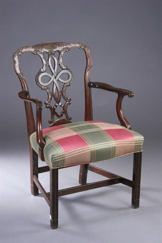 ENGLISH CHIPPENDALE STYLE ARMCHAIR 20th century Well carved crest pierced
