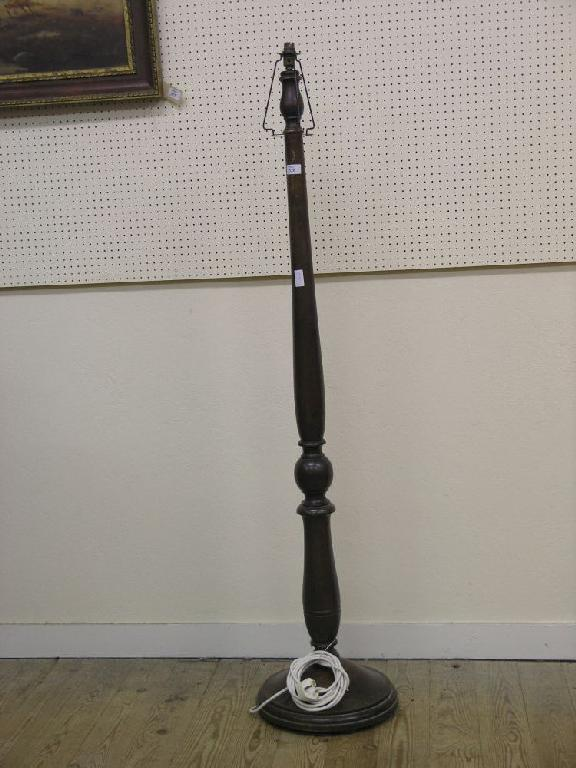 A mahogany standard lamp