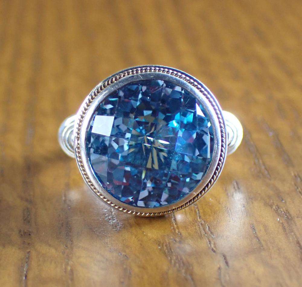 BLUE TOPAZ STERLING AND EIGHTEEN KARAT GOLD EFFY RING The