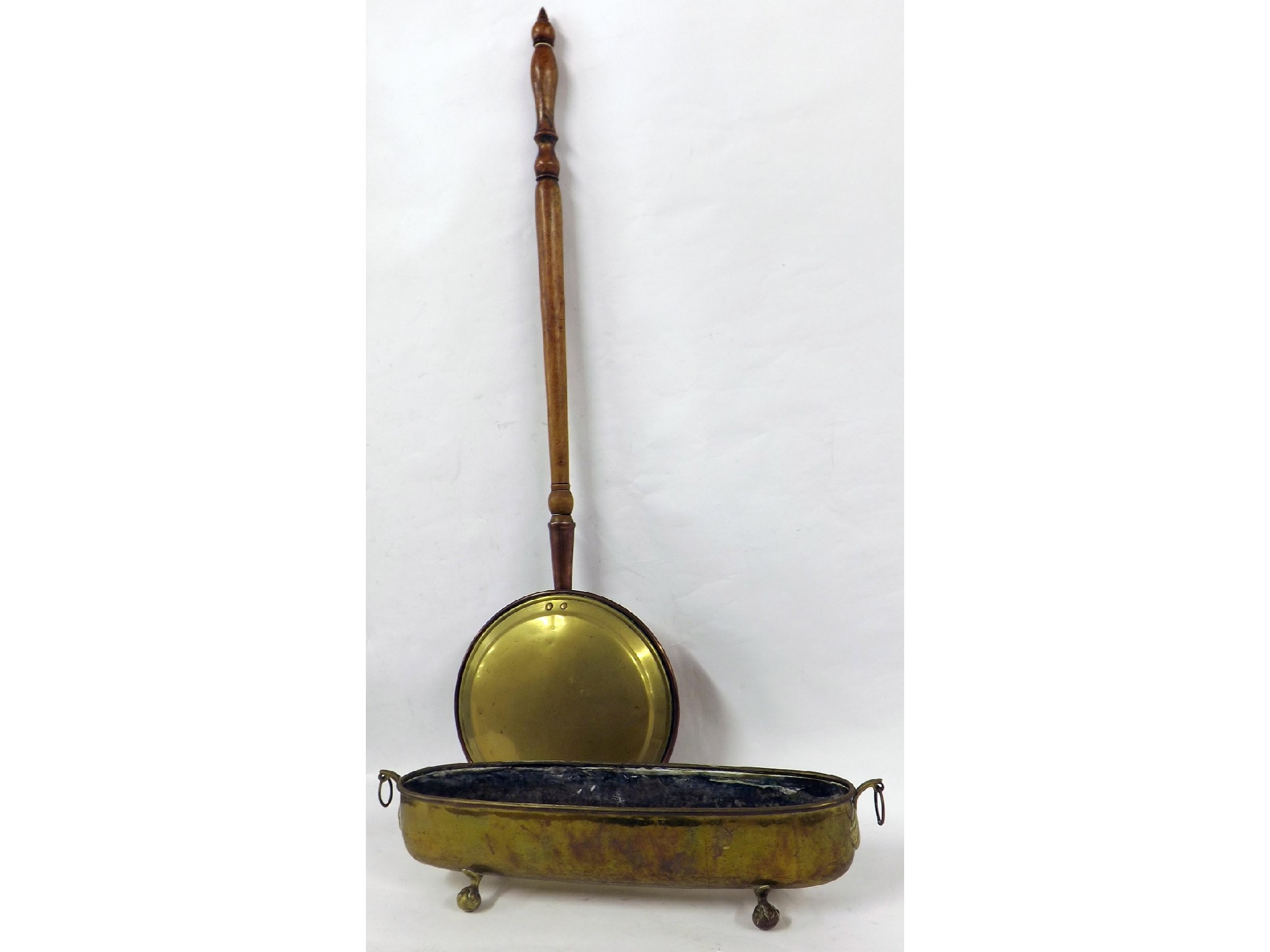 Oval brass twin handled planter upon claw and ball feet