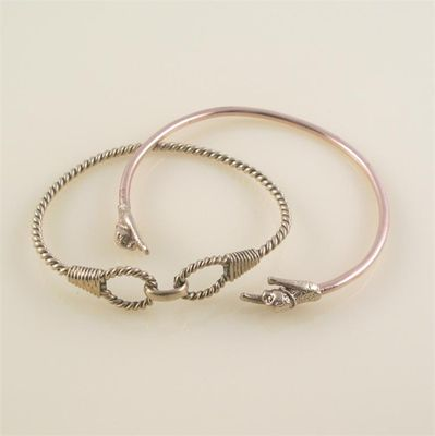 Two gold bangles one rope twist inscribed Gucci and 18K