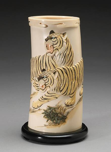 A carved ivory tusk 20th Century The large curving segment