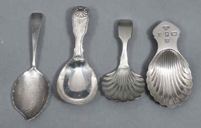 A CONTEMPORARY SILVER CADDY SPOON with scallop shell bowl London