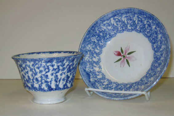 ENGLISH SPATTERWARE Blue spatter handless cup and saucer decorated with