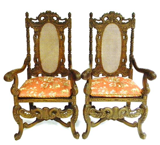 Pair of Baroque Revival throne arm chairs elaborately carved acorn