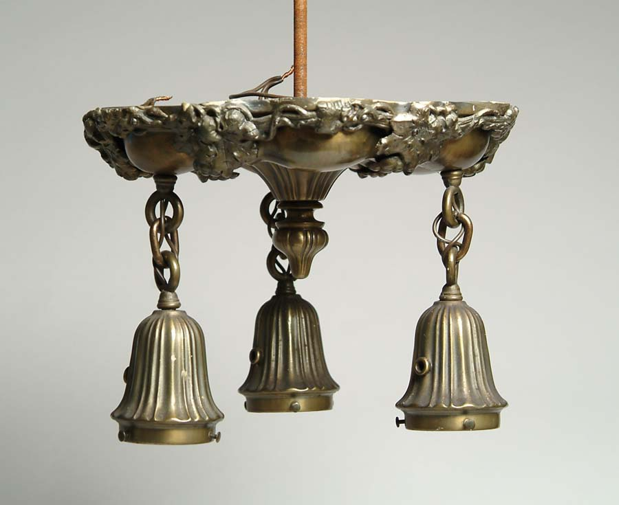 THREE LIGHT CEILING FIXTURE Brass ceiling fixture is trimmed at