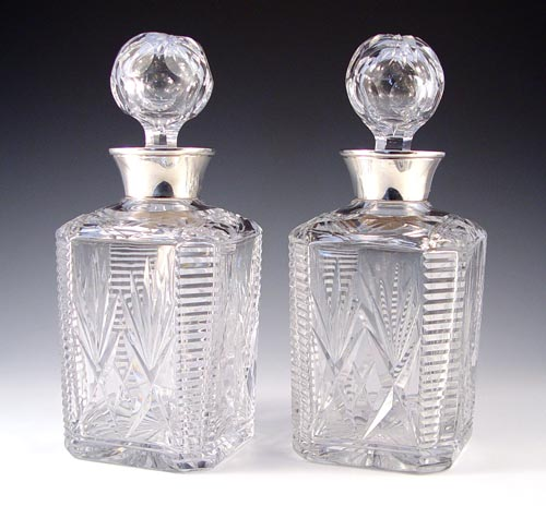 PAIR OF STERLING MOUNT CUT GLASS DECANTERS 20th century made
