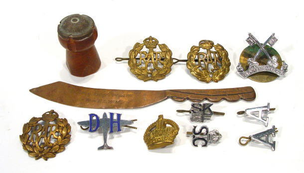Collection of Military hat pins a copper trench art paper