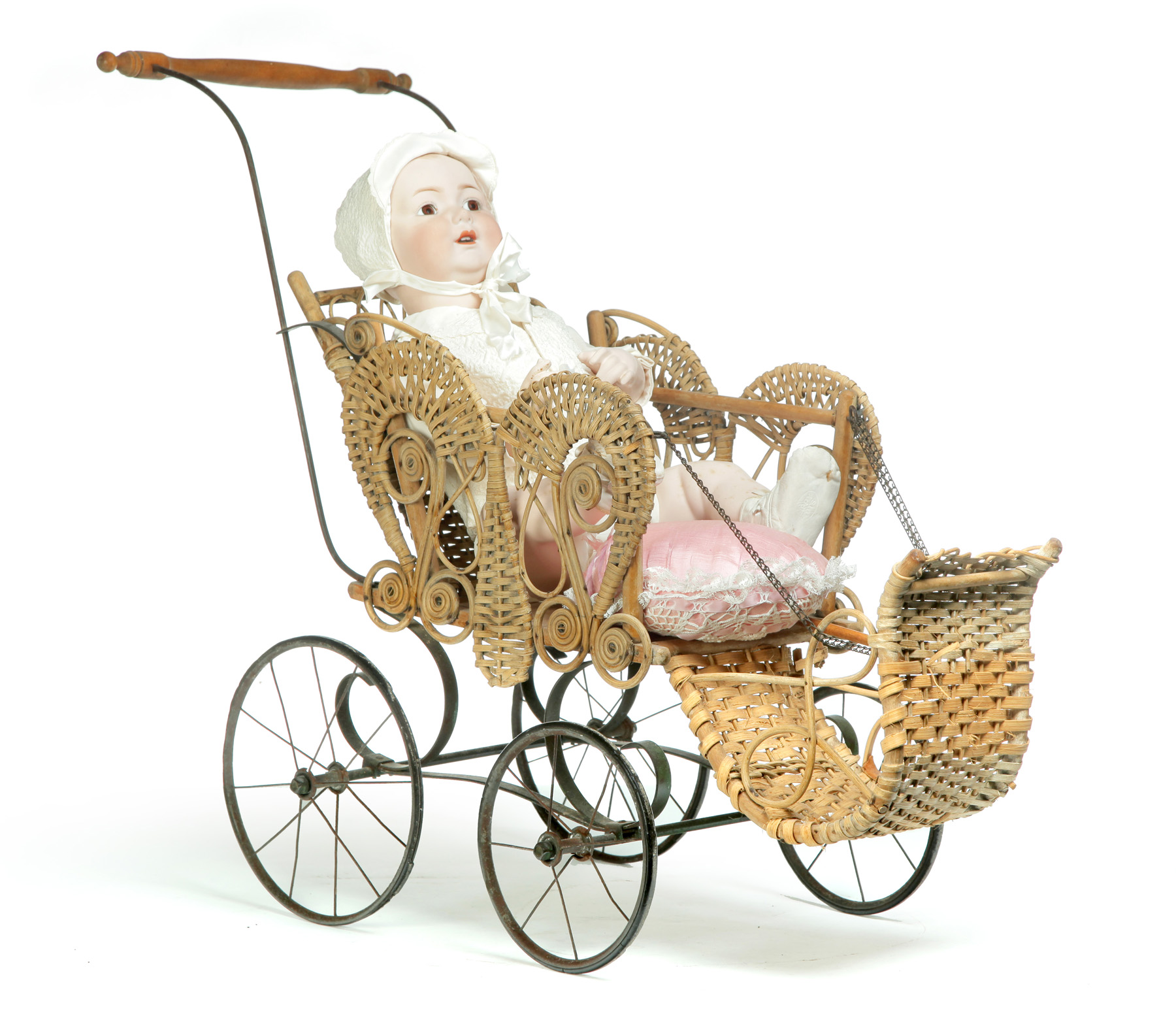 GERMAN BISQUE HEAD DOLL IN WICKER CARRIAGE First quarter 20th