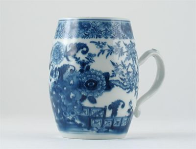 A Chinese blue and white barrel shaped mug painted with