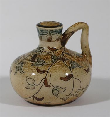 A Martin Brothers stoneware single handled vase incised with a