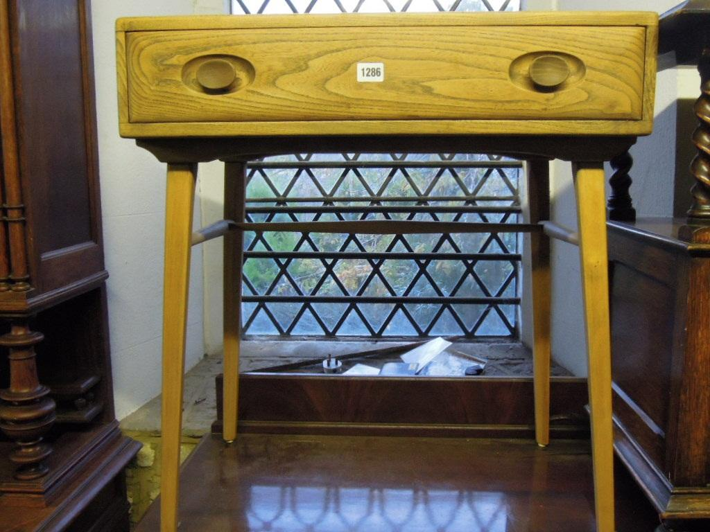 A stripped elm and beech wood side table probably Ercol