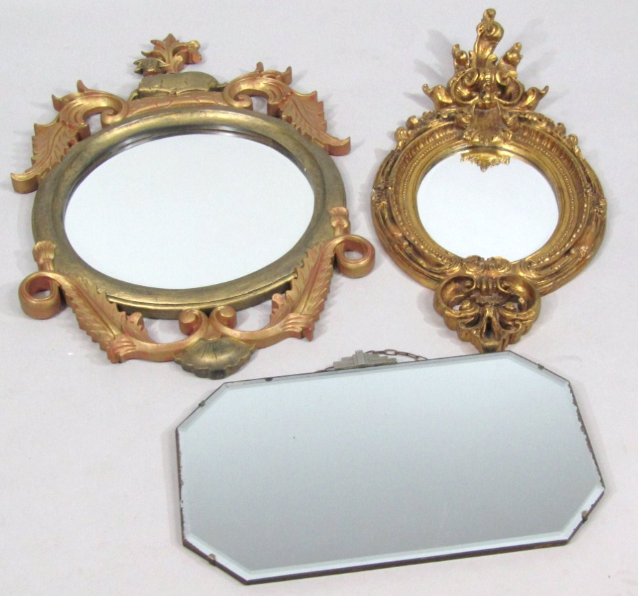 A 20thC rococo design wall mirror the oval glass in