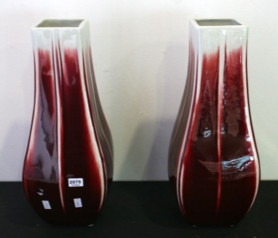 A pair of red and white square form vases 40cms
