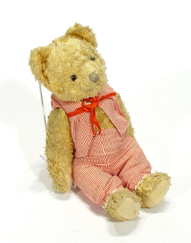 Old jointed golden teddy bear in pyjamas 33cm high