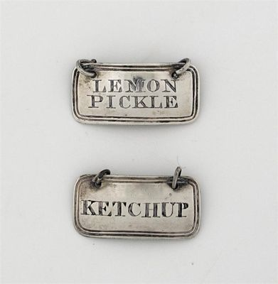 A pair of late George III sauce labels reeded oblong