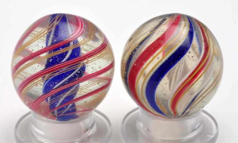 Lot of 2 Swirl Marbles Description Includes one blue solid