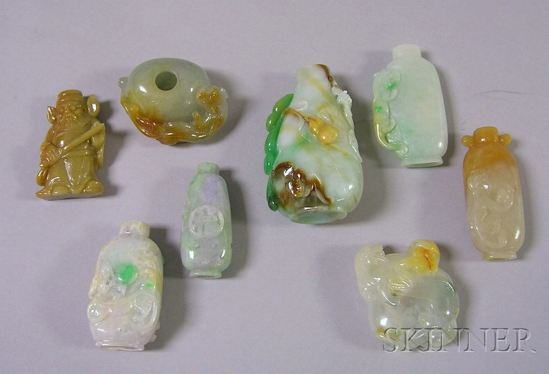 Eight Asian Carved Stone Snuff Bottles including a green brown