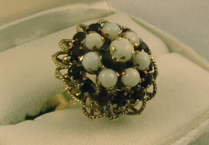 GARNET OPAL AND FOURTEEN KARAT CLUSTER RING set with eight