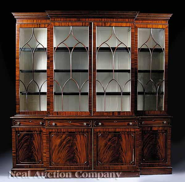 A George III Style Mahogany Breakfront Bookcase molded dentillated cornice
