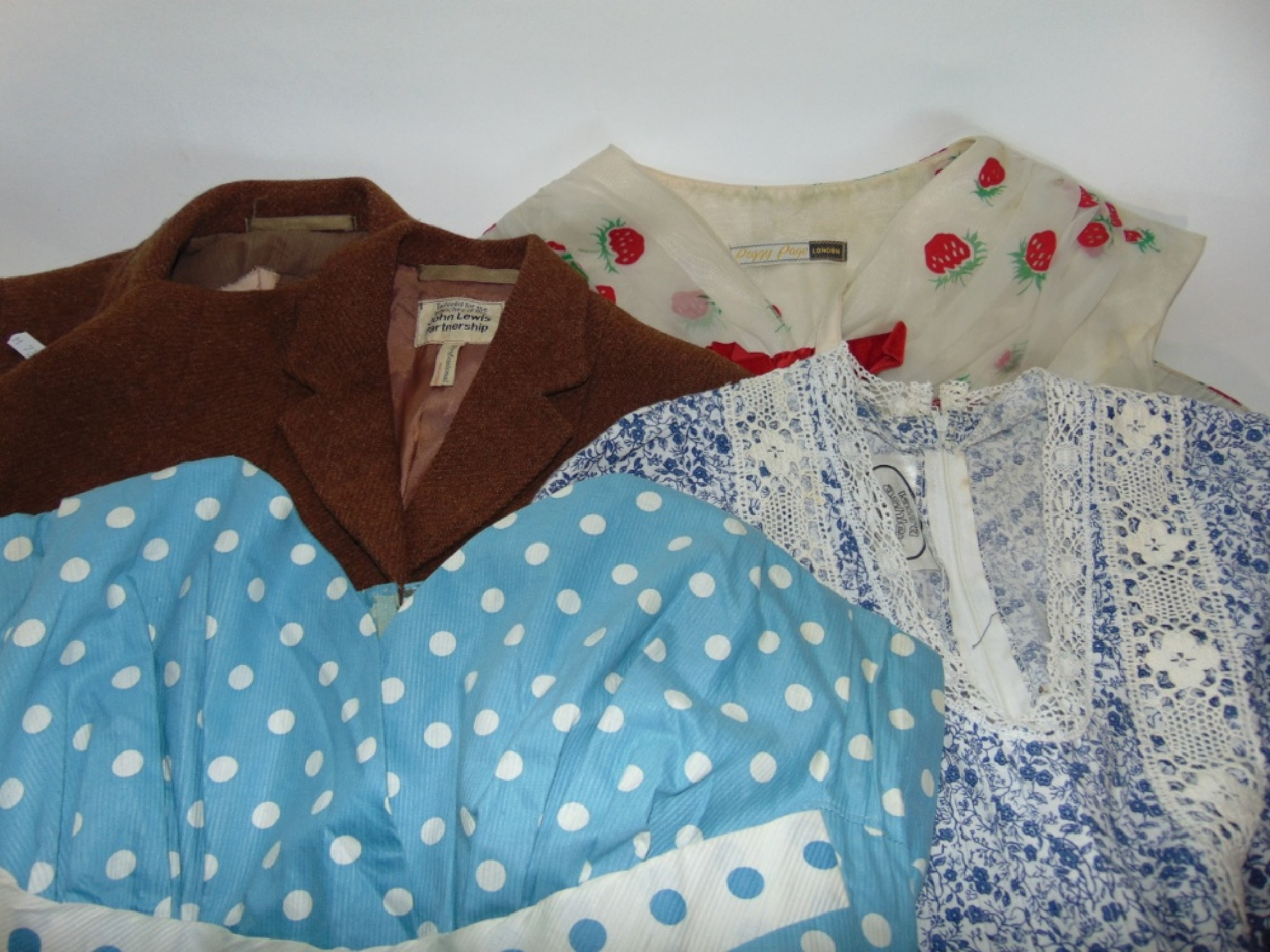 A selection of vintage clothing to include a child s