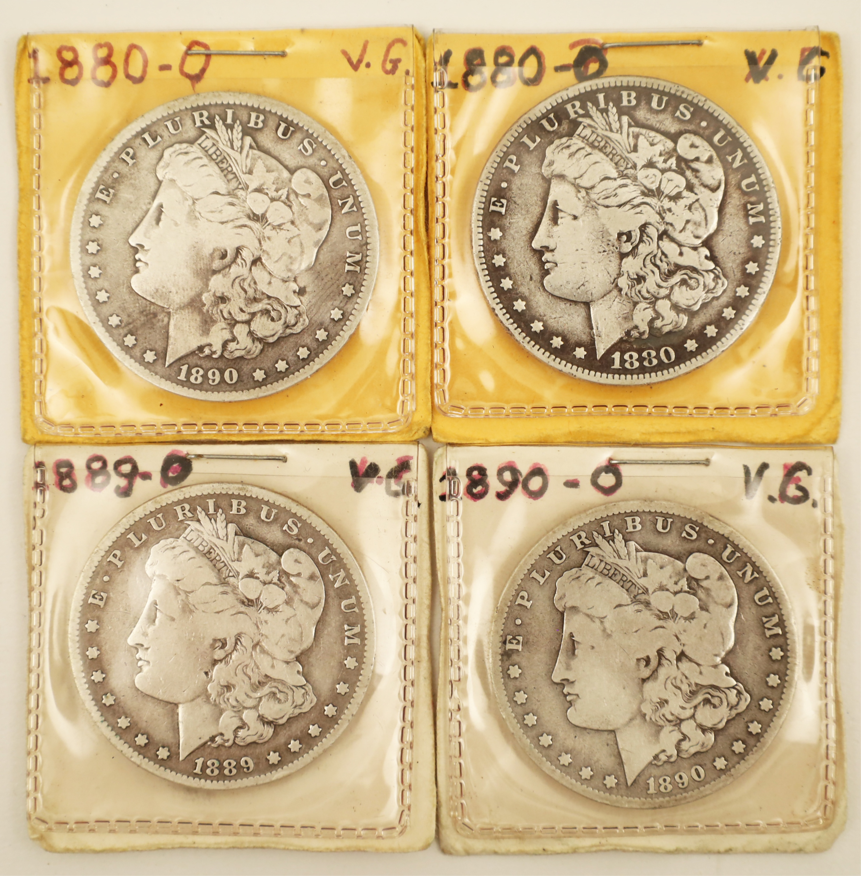 FOUR EARLY AMERICAN MORGAN SILVER DOLLARS Four early American Morgan