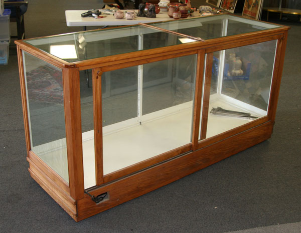 Lighted display case wood frame two shelves glass on all