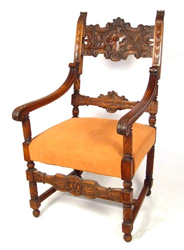 PROFUSELY CARVED THRONE CHAIR Refinished mahogany open arm chair 46