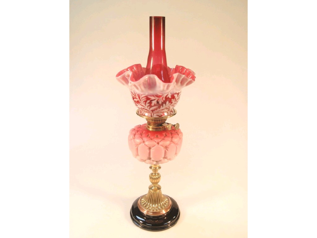 A 19thC oil lamp the Stourbridge pink satin quilted glass