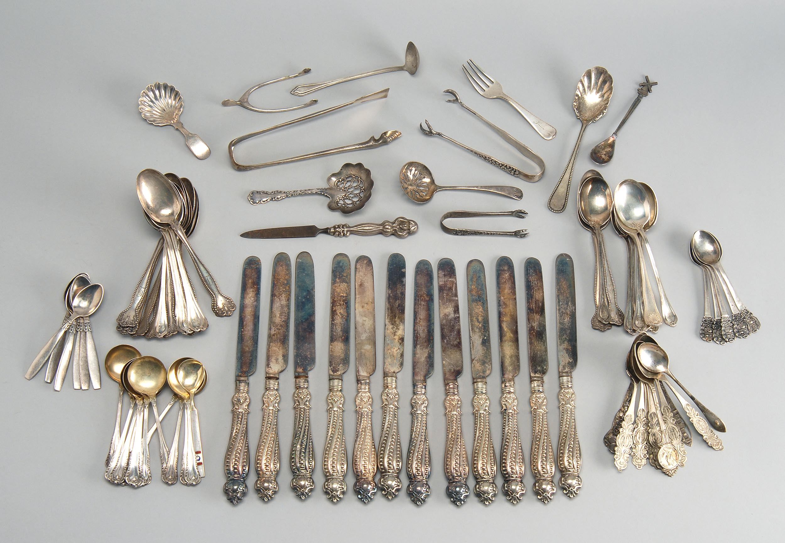 EIGHTY SEVEN PIECES OF STERLING SILVER AND SILVER PLATED FLATWARE