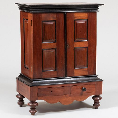 SMALL DUTCH BAROQUE STYLE EBONIZED MAHOGANY CABINET ON STANDIn two