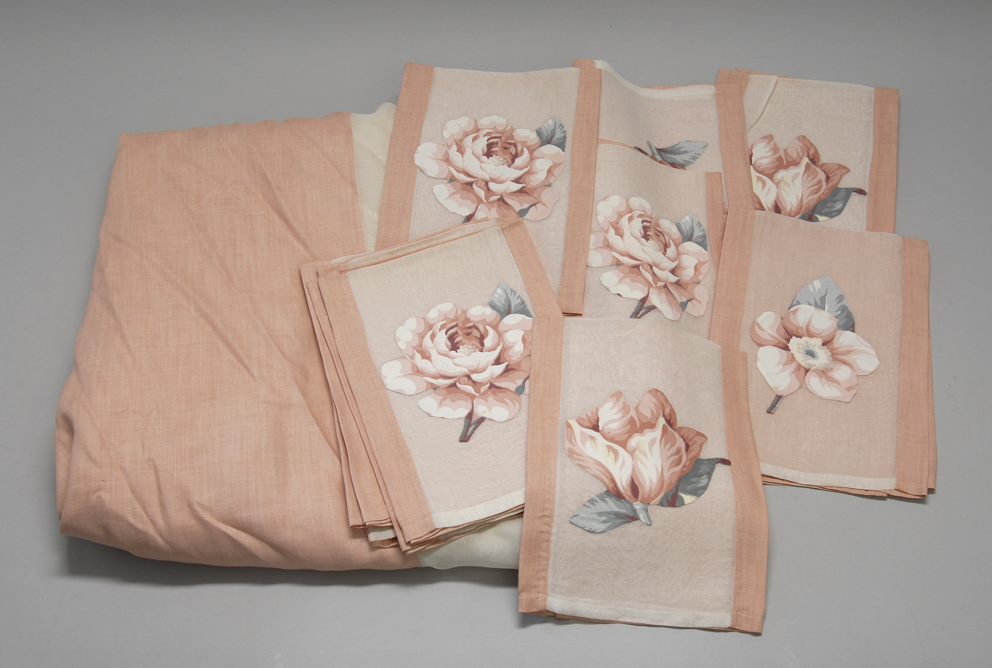 FRENCH APPLIQU D TABLECLOTH and twelve matching cloth napkins In