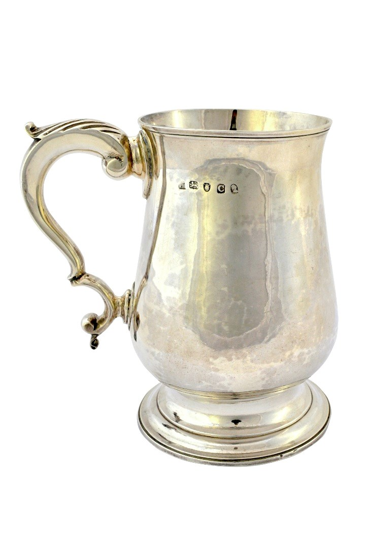 A George III silver mug of baluster form with a