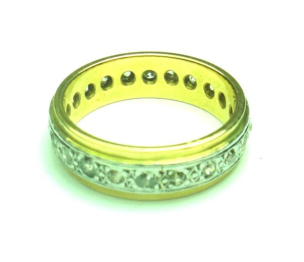 A gold and platinum diamond set full eternity ring mounted