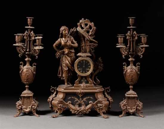 Victorian painted and enameled spelter figural three piece clock garniture
