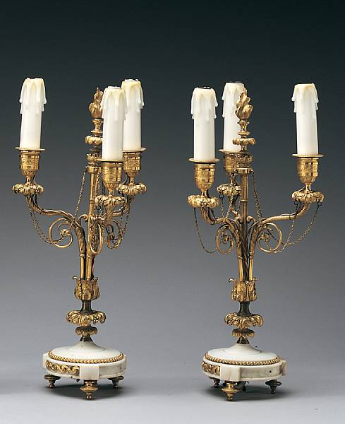 A pair of Louis XVI gilt bronze and white marble