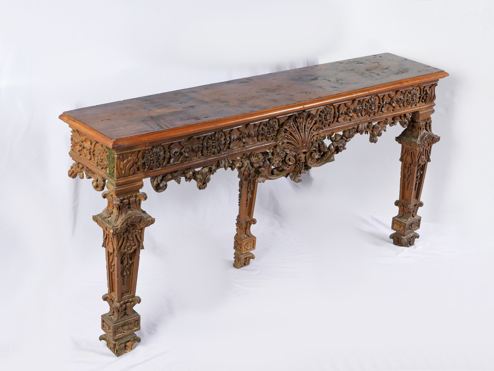 FINELY CARVED CONTINENTAL HALL TABLE Elaborately carved hall table having