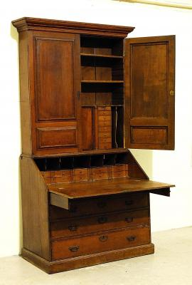 AN OAK BUREAU CABINET with pollard oak banding moulded cornice
