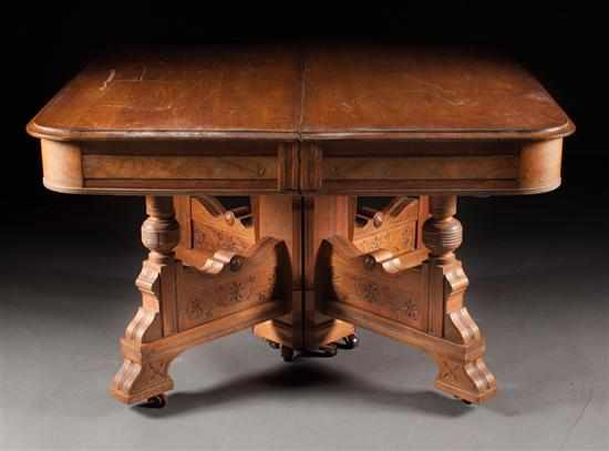Victorian Eastlake style walnut square dining table with four extension