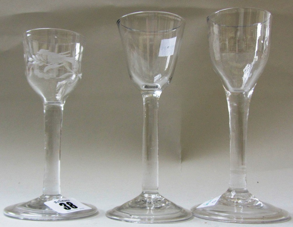 Three plain stemmed wine glasses mid 18th century one with