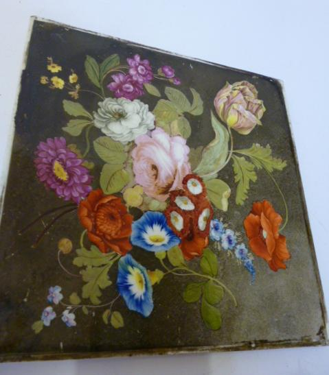 A SQUARE EARTHENWARE TILE PANEL mid 19th century painted in