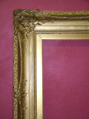 An English 19th Century Pierced Swept and Gilded Composition Frame