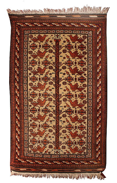A BELOUCH CAMEL GROUND RUG with central tree and bird