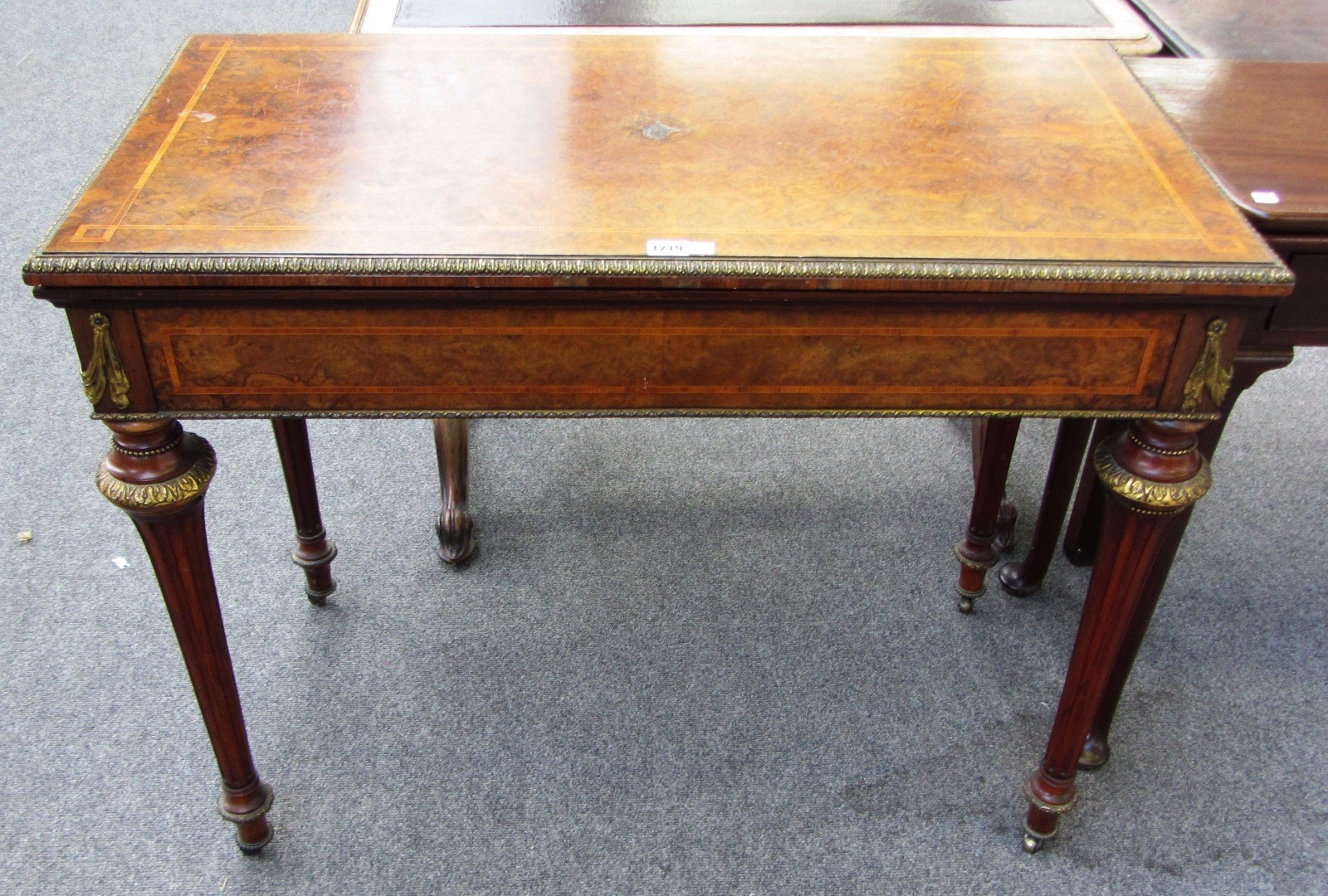 A 19th century gilt metal mounted kingwood banded figured walnut