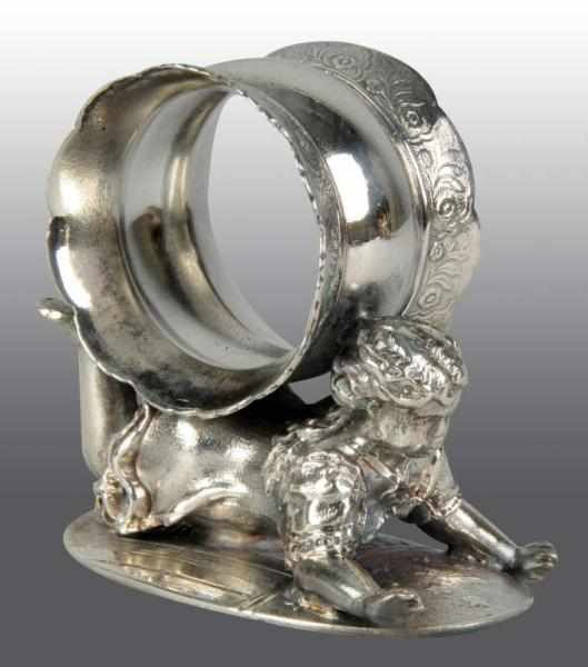 Girl Lies on Tummy Napkin Holder Description By Wilcox Silverplate